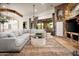Well-lit living room highlighting open design, seamlessly connecting indoor and outdoor spaces at 7788 E Morning Vista Ln, Scottsdale, AZ 85266