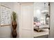 Charming main bedroom with a decorative sliding door and chandelier for a light, relaxing space at 7788 E Morning Vista Ln, Scottsdale, AZ 85266