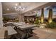 Covered patio features an elegant dining table with place settings and stunning desert views at 7788 E Morning Vista Ln, Scottsdale, AZ 85266