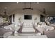 Spacious covered patio offers comfortable seating, a TV, and elegant decor at 7788 E Morning Vista Ln, Scottsdale, AZ 85266