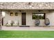 Covered patio with comfortable seating, ceiling fans, and hanging chairs at 7788 E Morning Vista Ln, Scottsdale, AZ 85266
