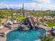 Resort-style pool with a rock slide, spa, and putting green, perfect for outdoor enjoyment at 7788 E Morning Vista Ln, Scottsdale, AZ 85266