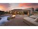 Dreamy backyard with a sparkling pool, inviting fire pit, and plush lounge chairs perfect for sunset relaxation at 7788 E Morning Vista Ln, Scottsdale, AZ 85266