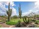 Private putting green surrounded by desert flora, offering a tranquil space for golf practice at 7788 E Morning Vista Ln, Scottsdale, AZ 85266