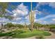 Scenic putting green with mature Saguaro cacti creating a unique golfing experience at 7788 E Morning Vista Ln, Scottsdale, AZ 85266