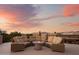 Relaxing rooftop deck with fire pit and comfortable lounge seating, perfect for sunset views at 7788 E Morning Vista Ln, Scottsdale, AZ 85266
