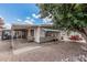Exterior home view highlighting the patio, outdoor furniture, and desert-style yard at 8323 E Deep Canyon Ct, Mesa, AZ 85208