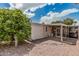 Quaint backyard patio leads into an enclosed lanai, an additional outdoor living space at 8323 E Deep Canyon Ct, Mesa, AZ 85208