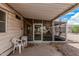 The covered patio connects to a lovely enclosed porch, making it a perfect space for relaxation and gatherings at 8323 E Deep Canyon Ct, Mesa, AZ 85208