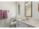 Bathroom with marble countertops, toilet, towels, and a mirror at 8323 E Deep Canyon Ct, Mesa, AZ 85208