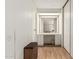 Bathroom vanity and mirror with a small bench seat and wooden floors at 8323 E Deep Canyon Ct, Mesa, AZ 85208