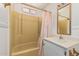 A well-lit bathroom featuring a classic yellow shower and modern vanity at 8323 E Deep Canyon Ct, Mesa, AZ 85208