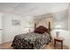 Bedroom featuring wood bedframe with nightstands and lamps at 8323 E Deep Canyon Ct, Mesa, AZ 85208