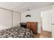 Bedroom with bed, wooden dresser, and keyboard at 8323 E Deep Canyon Ct, Mesa, AZ 85208