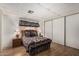 Cozy bedroom with a queen-sized bed and ample closet space at 8323 E Deep Canyon Ct, Mesa, AZ 85208