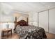 Bedroom with wooden furniture and lamps on either side of the bed at 8323 E Deep Canyon Ct, Mesa, AZ 85208
