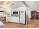Well-lit kitchen featuring classic appliances and tile backsplash at 8323 E Deep Canyon Ct, Mesa, AZ 85208