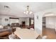 Spacious living and dining area with hardwood floors and lots of natural light at 8323 E Deep Canyon Ct, Mesa, AZ 85208