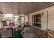 Inviting enclosed patio with ample seating, ideal for enjoying outdoor living and entertaining guests at 8323 E Deep Canyon Ct, Mesa, AZ 85208