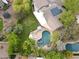 Expansive backyard featuring a private pool, lush landscaping, and mature trees at 9015 E Altadena Ave, Scottsdale, AZ 85260