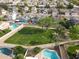 Aerial view of a community park, pools, and residential homes at 9015 E Altadena Ave, Scottsdale, AZ 85260