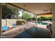Enjoy the spacious backyard featuring a pool, ping pong table, and ample seating for outdoor gatherings at 9015 E Altadena Ave, Scottsdale, AZ 85260