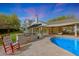 Backyard featuring swimming pool, built in barbeque, and expansive patio, ideal for outdoor entertaining at 9015 E Altadena Ave, Scottsdale, AZ 85260