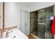 Well-lit bathroom with a modern vanity, glass-enclosed shower, and neutral tones, providing a clean and stylish space at 9015 E Altadena Ave, Scottsdale, AZ 85260