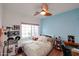 Bedroom featuring a large window and a bed with white bedding at 9015 E Altadena Ave, Scottsdale, AZ 85260