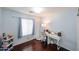 Inviting room featuring a light fixture, wood floors, and space for a desk at 9015 E Altadena Ave, Scottsdale, AZ 85260