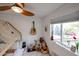 Light bedroom featuring a bed frame, wood floors and a ceiling fan at 9015 E Altadena Ave, Scottsdale, AZ 85260