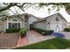 Charming single-story home with mature landscaping and a well-manicured artificial lawn at 9015 E Altadena Ave, Scottsdale, AZ 85260