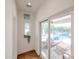 Bright hallway featuring a view of the pool and patio through a sliding glass door at 9015 E Altadena Ave, Scottsdale, AZ 85260