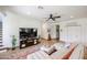 Comfortable living room with a plush sofa, TV, and ample space for relaxation at 9015 E Altadena Ave, Scottsdale, AZ 85260