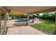 Entertainer's backyard features a covered patio, built-in grill, and sparkling pool at 9015 E Altadena Ave, Scottsdale, AZ 85260
