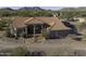 Aerial view of a Southwestern-style house featuring a red tile roof and desert landscaping at 9690 W Martin Rd, Casa Grande, AZ 85194