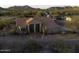 Aerial view of the home with desert landscaping, arches and tile roof at 9690 W Martin Rd, Casa Grande, AZ 85194