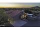Aerial shot of home with 3-car garage, patio, deck, and pool at 9690 W Martin Rd, Casa Grande, AZ 85194