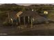 Aerial view of a Southwestern home, showcasing its desert landscape and mountain backdrop at 9690 W Martin Rd, Casa Grande, AZ 85194