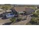 Aerial view of backyard showcasing pool, patio, and desert landscaping at 9690 W Martin Rd, Casa Grande, AZ 85194