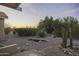 Backyard with desert landscaping, wooden bridge, and natural surroundings at 9690 W Martin Rd, Casa Grande, AZ 85194