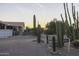 Property featuring desert landscaping, a wooden fence, and a view of the home at sunset at 9690 W Martin Rd, Casa Grande, AZ 85194