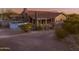Backyard showcasing an above-ground pool, covered patio, and mature desert vegetation at 9690 W Martin Rd, Casa Grande, AZ 85194