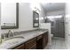 Bathroom with dual vanity sinks, granite countertops, and a glass-enclosed shower for a luxurious feel at 9690 W Martin Rd, Casa Grande, AZ 85194