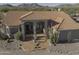 Desert home with red tile roof and desert landscaping at 9690 W Martin Rd, Casa Grande, AZ 85194