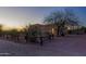 Charming desert home featuring a tile roof, garage, and wood fence, perfect for relaxed living at 9690 W Martin Rd, Casa Grande, AZ 85194