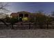 Inviting exterior showcasing a home with a tile roof, arches, and desert landscaping at 9690 W Martin Rd, Casa Grande, AZ 85194