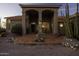 Inviting front entrance with arches, tiled porch and beautiful desert landscaping at 9690 W Martin Rd, Casa Grande, AZ 85194