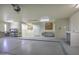 Three car garage with work benches and painted floor at 9690 W Martin Rd, Casa Grande, AZ 85194