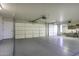 A spacious three car garage featuring painted floors and ample storage at 9690 W Martin Rd, Casa Grande, AZ 85194